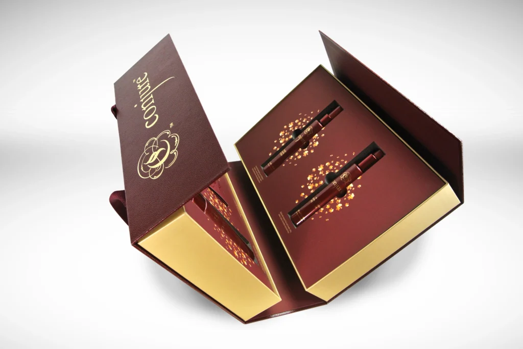 Luxury luxury sample box with rope handles designed and produced by Fastkit for Conjure Cognac spirits brand, shown from the side profile featuring premium board with custom rope handles and full-color print