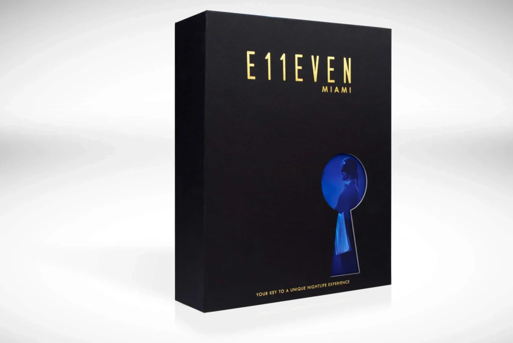 Luxury exclusive launch event box designed and produced by Fastkit for E11even Miami nightclub brand, photographed at a three-quarter angle featuring high-gloss print with metallic foil and bold structural design