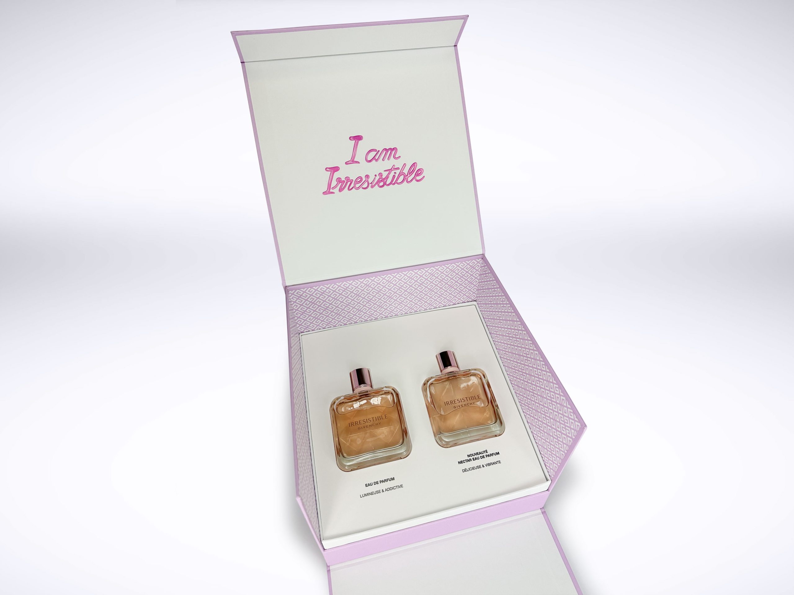 Custom luxury rigid gift box for LVMH Givenchy Irresistible fragrance with two perfume bottles and pink packaging by Fastkit